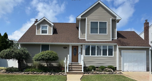 3805 Mansfield Dr, Seaford, NY 11783 - view of front facade featuring entry steps, a chimney, a garage, a shingled roof, and concrete driveway