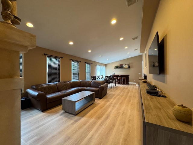 3805 Mansfield Dr, Seaford, NY 11783 - living room featuring light wood-style flooring, lofted ceiling, and recessed lighting