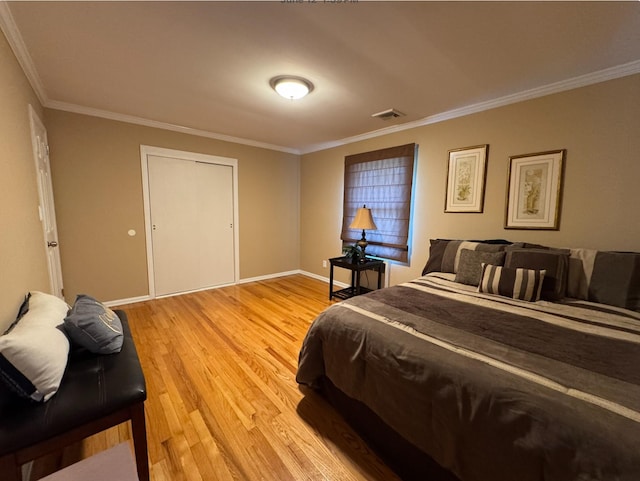 3805 Mansfield Dr, Seaford, NY 11783 - bedroom with ornamental molding and light wood-style flooring