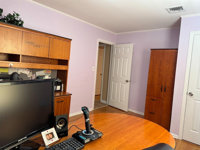 3805 Mansfield Dr, Seaford, NY 11783 - home office featuring light wood finished floors and crown molding