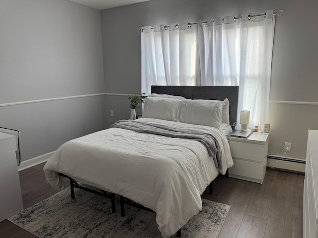 3805 Mansfield Dr, Seaford, NY 11783 - bedroom with a baseboard radiator and wood finished floors