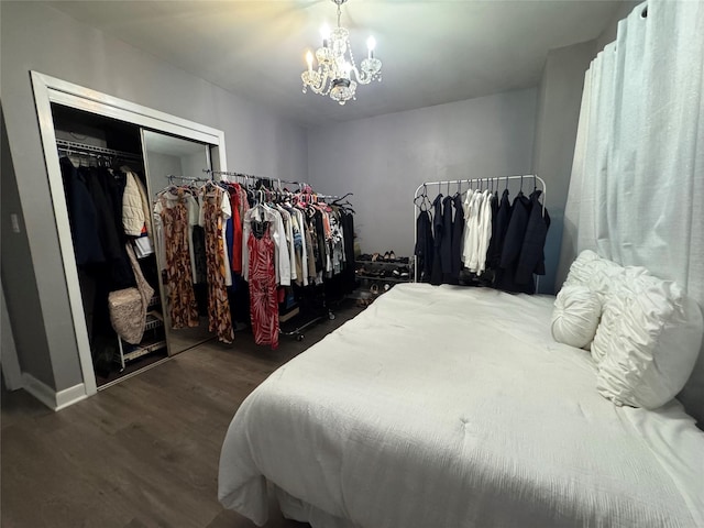 3805 Mansfield Dr, Seaford, NY 11783 - bedroom featuring wood finished floors, a closet, and a chandelier