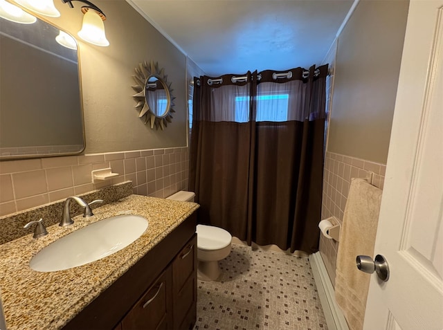 3805 Mansfield Dr, Seaford, NY 11783 - bathroom featuring tile walls, vanity, a wainscoted wall, shower / bathtub combination with curtain, and ornamental molding