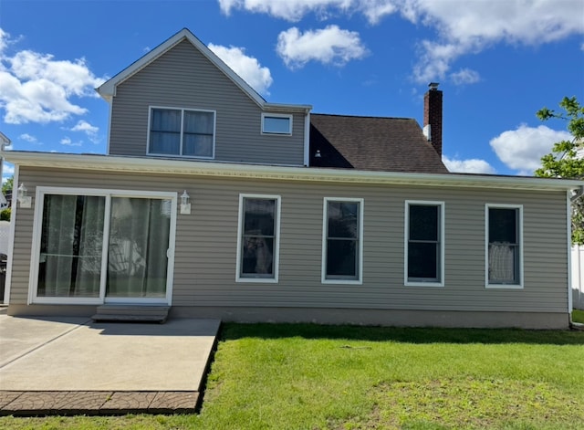 3805 Mansfield Dr, Seaford, NY 11783 - back of property featuring a patio area, a lawn, and a chimney