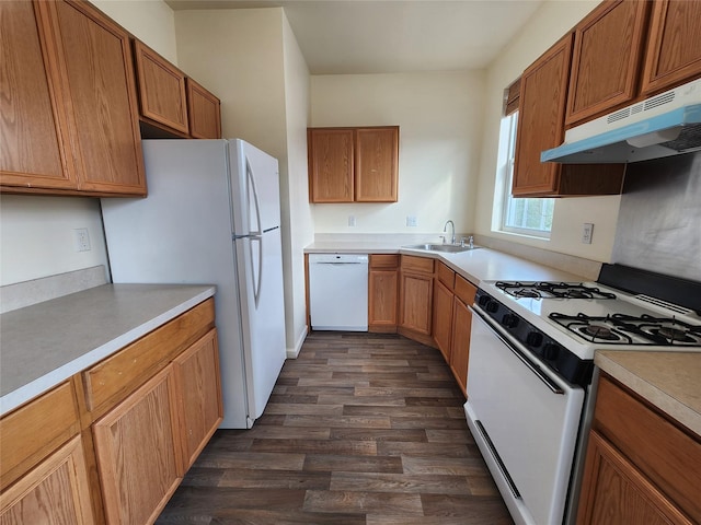 47 Pipetown Hill Radl, Nanuet, NY 10954 - kitchen featuring white appliances, under cabinet range hood, dark wood-type flooring, light countertops, and brown cabinets