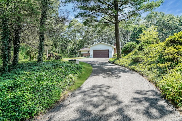 203 Deer Park Rd, Dix Hills, NY 11746 - ranch-style home featuring an outbuilding, a garage, and asphalt driveway