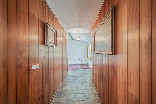 203 Deer Park Rd, Dix Hills, NY 11746 - hallway with stone tile floors and wooden walls