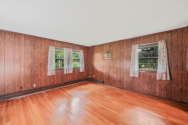 203 Deer Park Rd, Dix Hills, NY 11746 - unfurnished room with wood finished floors and wood walls