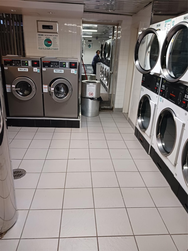 8710 51st Ave Unit 1P, Elmhurst, NY 11373 - communal laundry room with estacked washer and dryer, washer and clothes dryer, and tile patterned flooring
