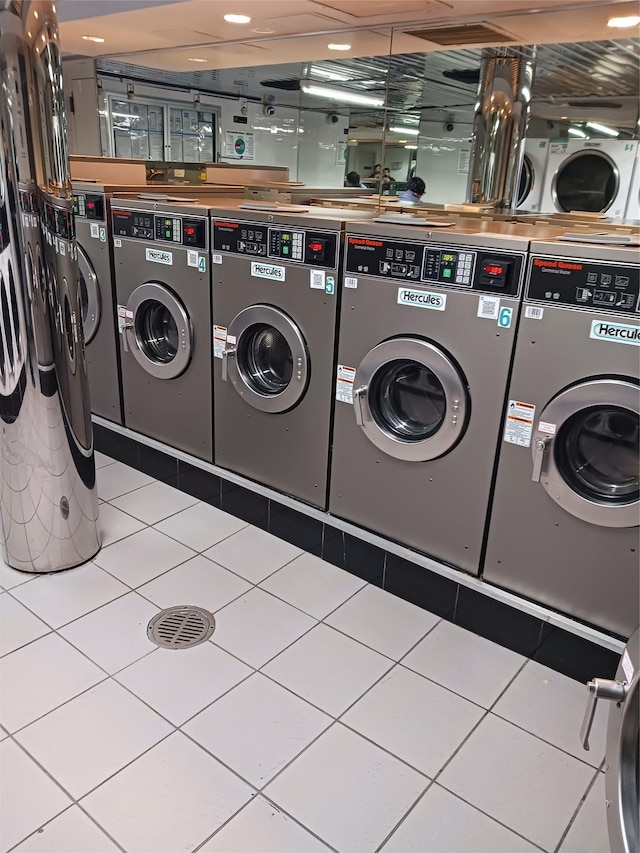 8710 51st Ave Unit 1P, Elmhurst, NY 11373 - communal laundry room with washing machine and clothes dryer and tile patterned floors