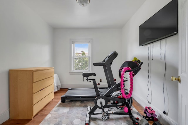 7609 79th St, Glendale, NY 11385 - workout room featuring wood finished floors and baseboards