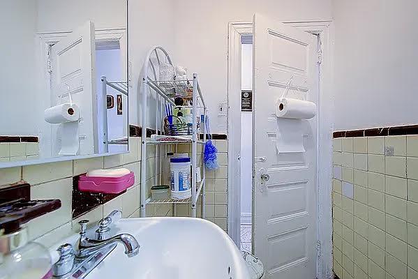 1304 Pacific St Unit B1, Brooklyn, NY 11216 - bathroom with tile walls and wainscoting