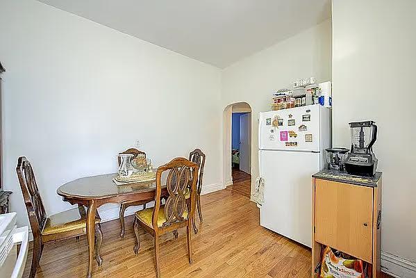 1304 Pacific St Unit B1, Brooklyn, NY 11216 - dining space featuring arched walkways and light wood-style floors