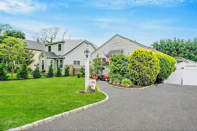24 Lowerre St, Babylon, NY 11702 - view of front of home with a gate