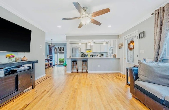 24 Lowerre St, Babylon, NY 11702 - living room featuring crown molding, light wood finished floors, a ceiling fan, and recessed lighting