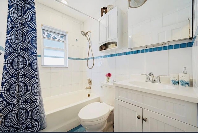 24 Lowerre St, Babylon, NY 11702 - bathroom featuring vanity, tile walls, shower / bath combo, and tasteful backsplash