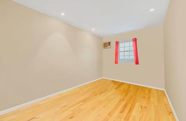 24 Lowerre St, Babylon, NY 11702 - empty room featuring wood finished floors and recessed lighting
