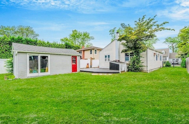 24 Lowerre St, Babylon, NY 11702 - rear view of property with a fenced backyard, an outdoor structure, and a patio area
