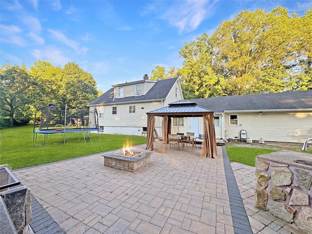 41 School St, Cortlandt Manor, NY 10567 - view of patio featuring a fire pit, a trampoline, and a gazebo