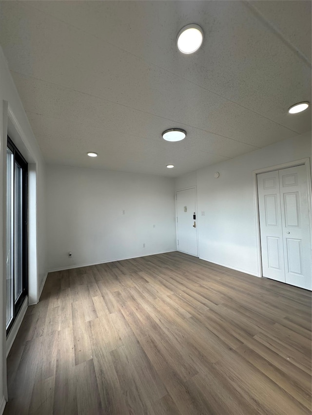 41-28 71st St Unit 4D, Woodside, NY 11377 - spare room featuring wood finished floors and recessed lighting