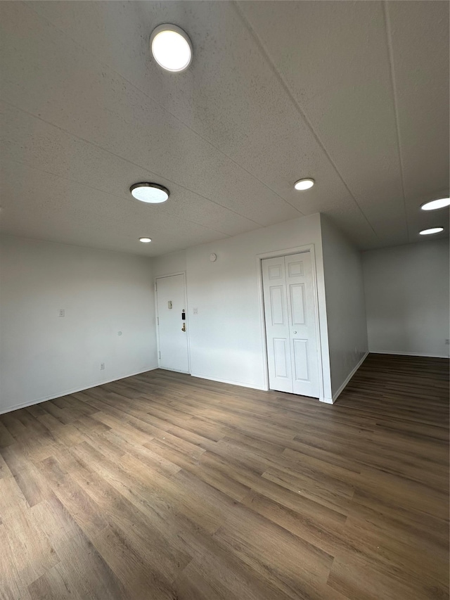 41-28 71st St Unit 4D, Woodside, NY 11377 - basement featuring wood finished floors and recessed lighting