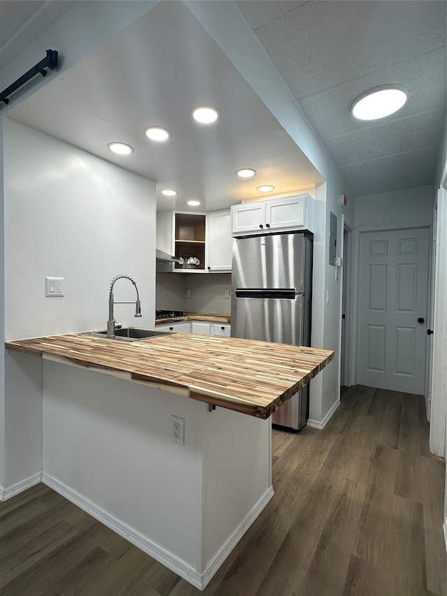 41-28 71st St Unit 4D, Woodside, NY 11377 - kitchen with wooden counters, a peninsula, freestanding refrigerator, dark wood-style floors, and recessed lighting