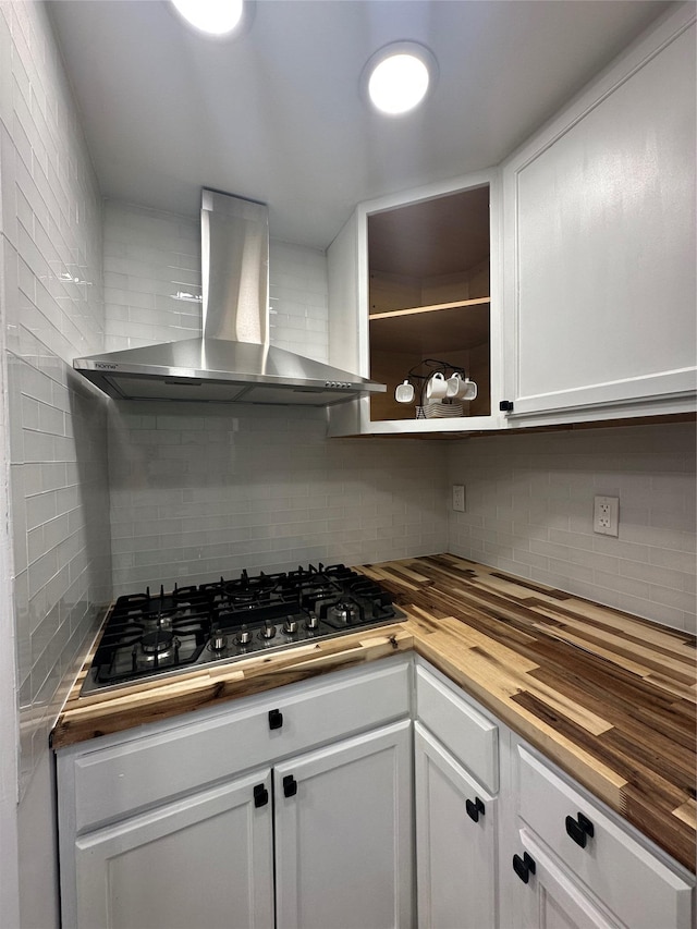 41-28 71st St Unit 4D, Woodside, NY 11377 - kitchen with wooden counters, wall chimney range hood, stainless steel gas stovetop, and backsplash