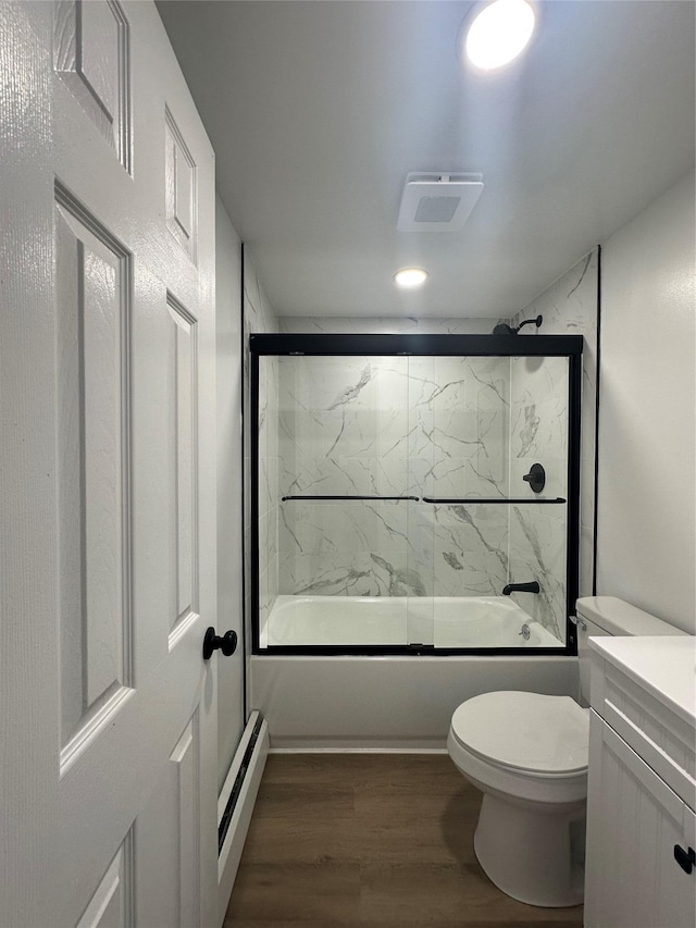 41-28 71st St Unit 4D, Woodside, NY 11377 - full bathroom featuring a baseboard radiator, combined bath / shower with glass door, wood finished floors, vanity, and recessed lighting