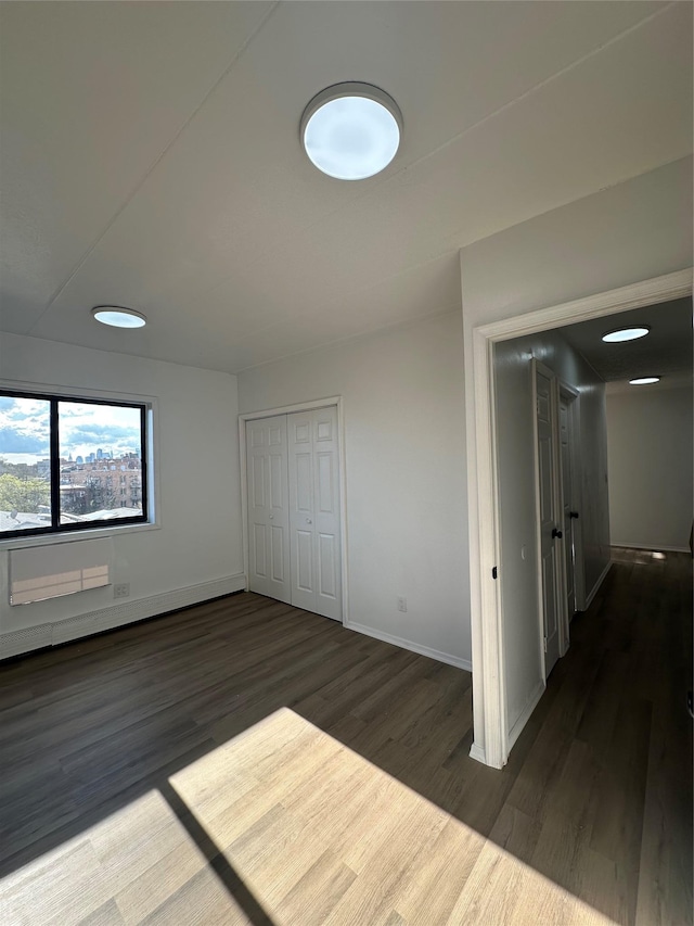 41-28 71st St Unit 4D, Woodside, NY 11377 - unfurnished bedroom with wood finished floors and a closet