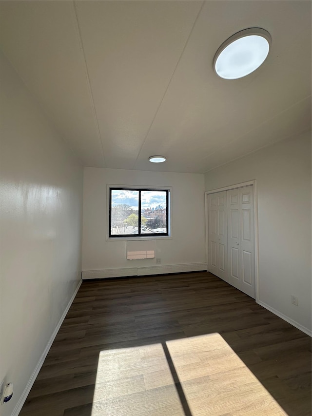 41-28 71st St Unit 4D, Woodside, NY 11377 - unfurnished bedroom featuring wood finished floors and a closet