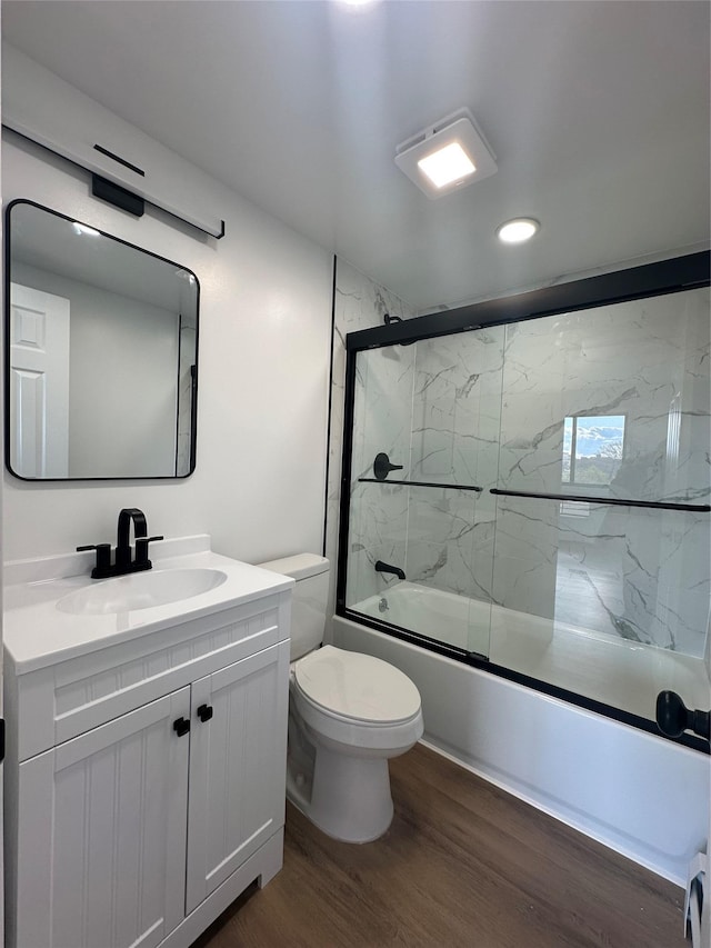 41-28 71st St Unit 4D, Woodside, NY 11377 - full bath featuring wood finished floors, vanity, bath / shower combo with glass door, and recessed lighting