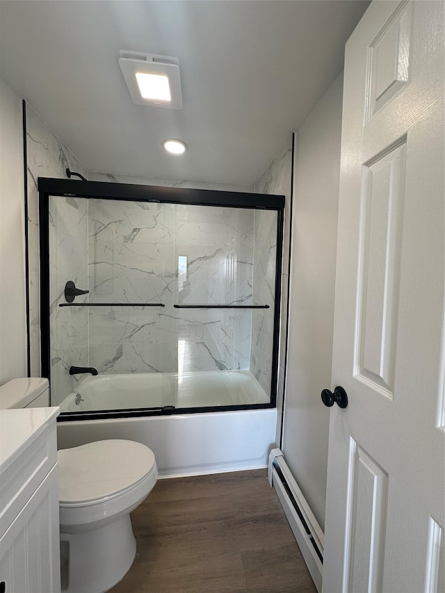 41-28 71st St Unit 4D, Woodside, NY 11377 - full bathroom featuring baseboard heating, bath / shower combo with glass door, wood finished floors, vanity, and recessed lighting