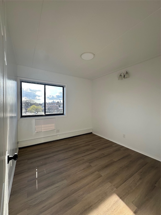 41-28 71st St Unit 4D, Woodside, NY 11377 - empty room with wood finished floors and a baseboard radiator
