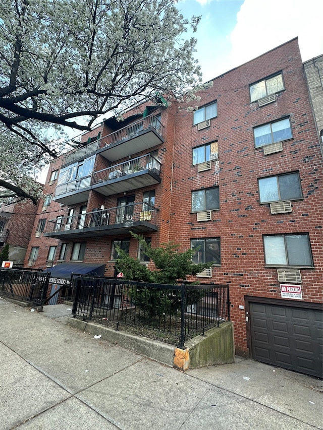 41-28 71st St Unit 4D, Woodside, NY 11377 - view of apartment building / complex with driveway and an attached garage