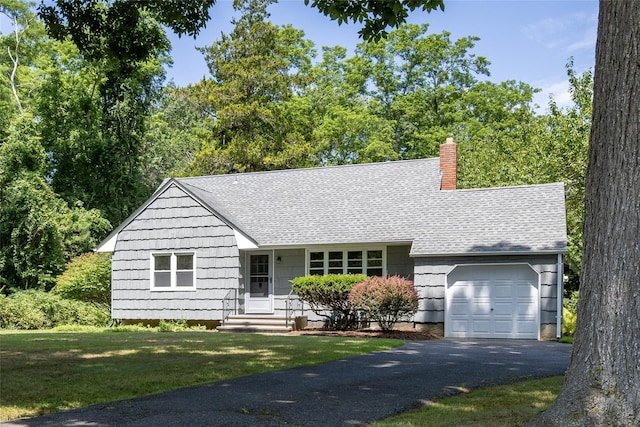 795 Pine Tree Rd, Cutchogue, NY 11935 - ranch-style house featuring a chimney, an attached garage, driveway, a front yard, and entry steps