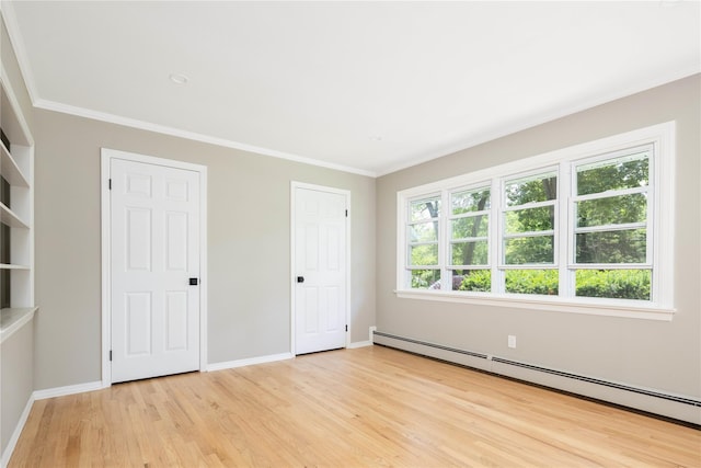 795 Pine Tree Rd, Cutchogue, NY 11935 - unfurnished bedroom with a baseboard heating unit, light wood finished floors, and crown molding