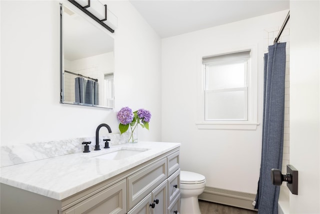 795 Pine Tree Rd, Cutchogue, NY 11935 - full bathroom featuring vanity, a baseboard radiator, a shower with shower curtain, and wood finished floors