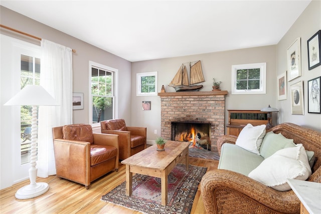 2860 Pine Tree Rd, Cutchogue, NY 11935 - living room featuring light wood-type flooring and a fireplace