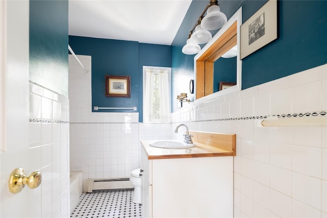 2860 Pine Tree Rd, Cutchogue, NY 11935 - bathroom with tile walls, a baseboard heating unit, vanity, shower / bath combination, and wainscoting