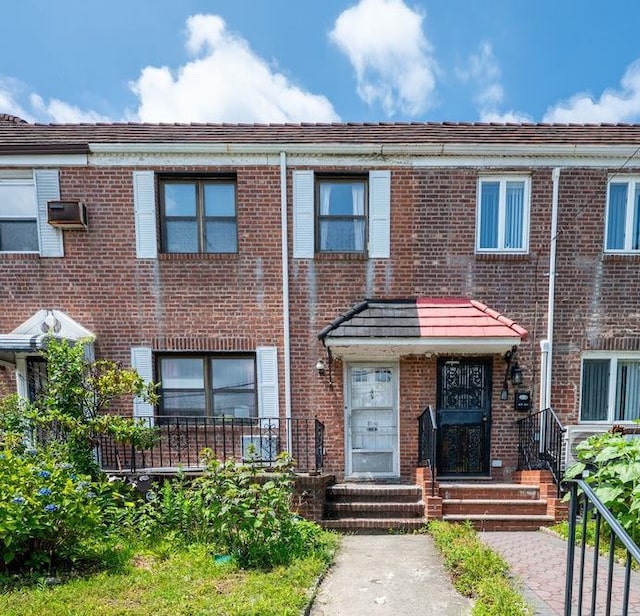 70-40 Utopia Pkwy, Fresh Meadows, NY 11365 - traditional-style house featuring brick siding