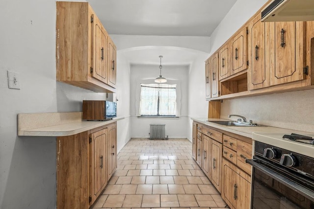 70-40 Utopia Pkwy, Fresh Meadows, NY 11365 - kitchen featuring range, arched walkways, light countertops, and radiator heating unit