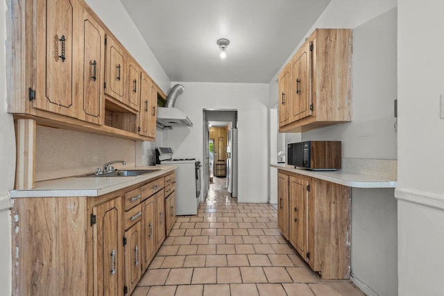 70-40 Utopia Pkwy, Fresh Meadows, NY 11365 - kitchen featuring black microwave, gas range gas stove, light countertops, exhaust hood, and freestanding refrigerator