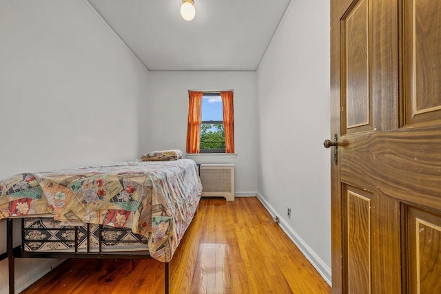 70-40 Utopia Pkwy, Fresh Meadows, NY 11365 - bedroom featuring radiator and light wood-style floors