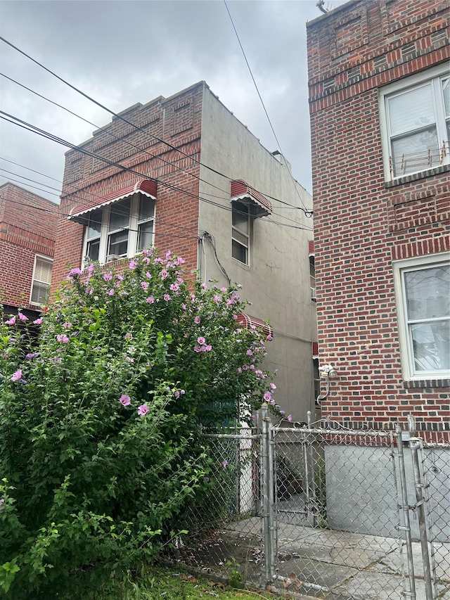 2237 Ellis Ave, Bronx, NY 10462 - view of home's exterior with a gate and brick siding