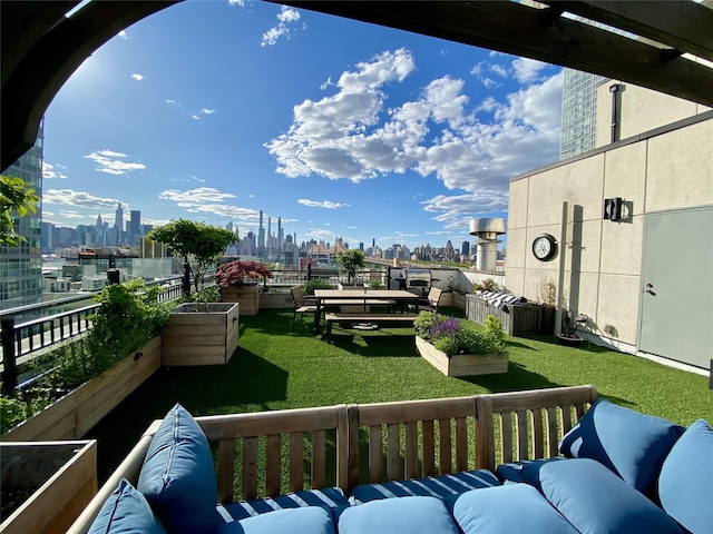 4260 Crescent St Unit 10C, Long Island City, NY 11101 - balcony featuring a skyline view and an outdoor living space