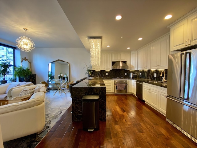 4260 Crescent St Unit 10C, Long Island City, NY 11101 - kitchen with stainless steel appliances, dark wood finished floors, open floor plan, a chandelier, and white cabinets