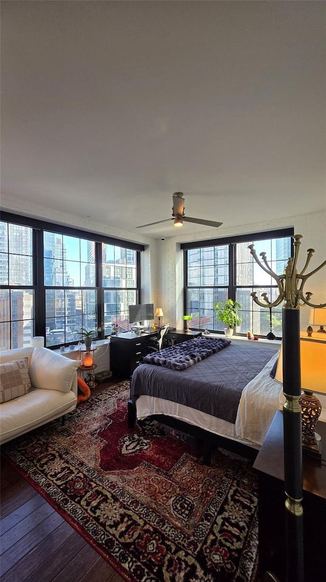 4260 Crescent St Unit 10C, Long Island City, NY 11101 - bedroom with wood finished floors, multiple windows, and ceiling fan
