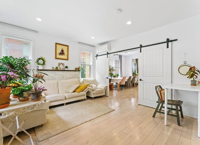 39-12 215th Pl, Bayside, NY 11362 - living area featuring a barn door, light wood-style floors, a wall mounted air conditioner, and recessed lighting