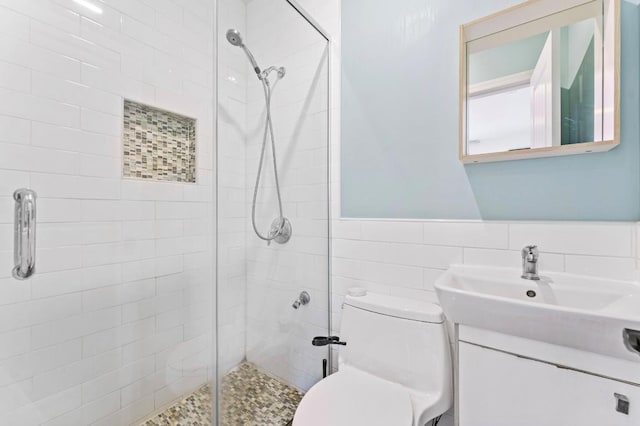 39-12 215th Pl, Bayside, NY 11362 - bathroom featuring a shower stall, tile walls, wainscoting, and vanity