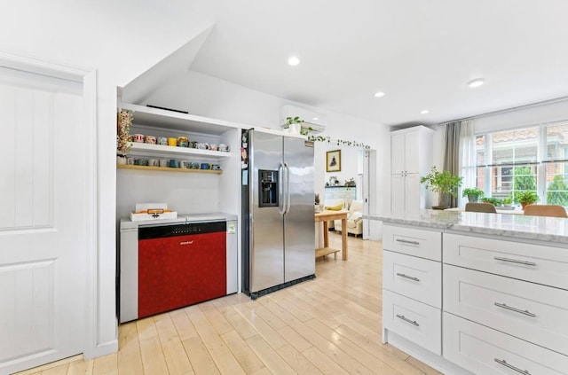 39-12 215th Pl, Bayside, NY 11362 - kitchen featuring stainless steel refrigerator with ice dispenser, light wood-style flooring, white cabinetry, light stone counters, and recessed lighting